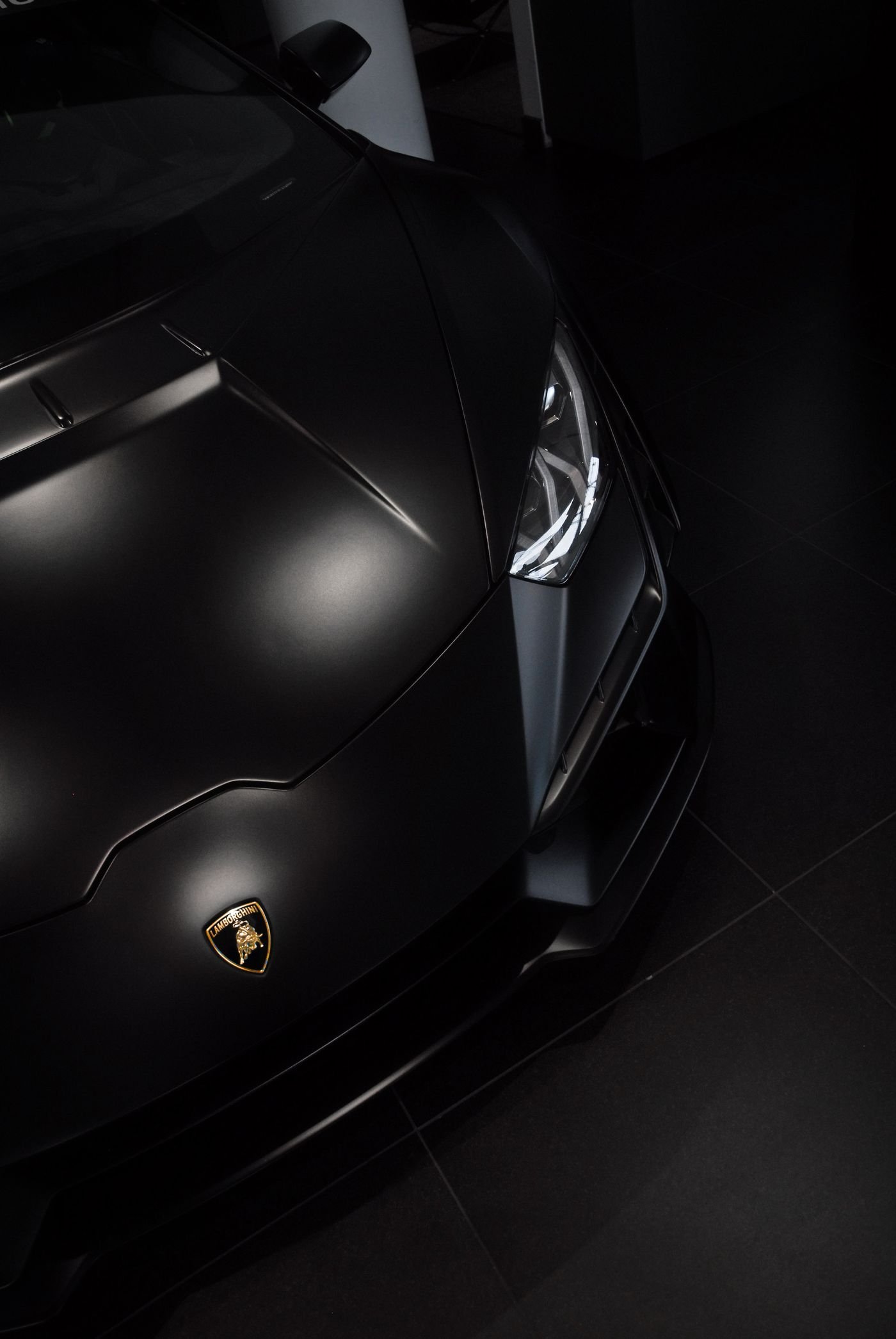 Matte black bodywork under workshop lighting